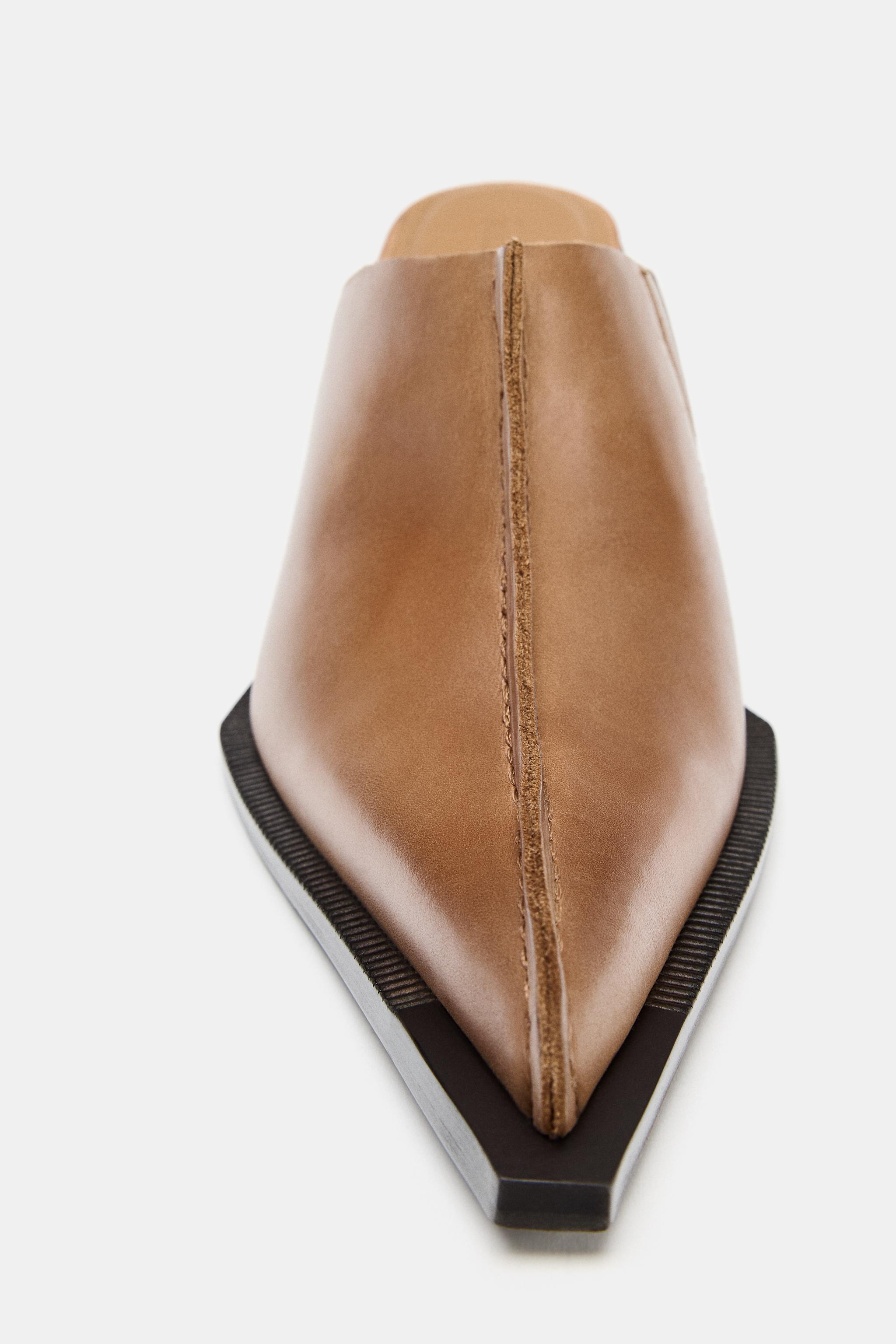 SABOTS EN CUIR AVEC SURPIQÛRE